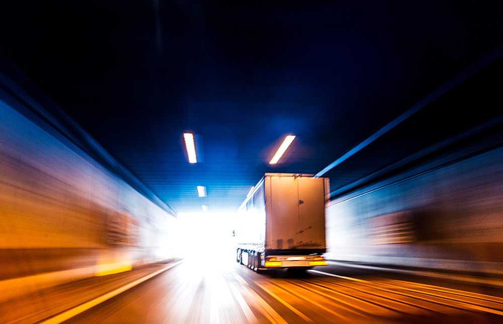 Transports Truck Driving in Tunnel